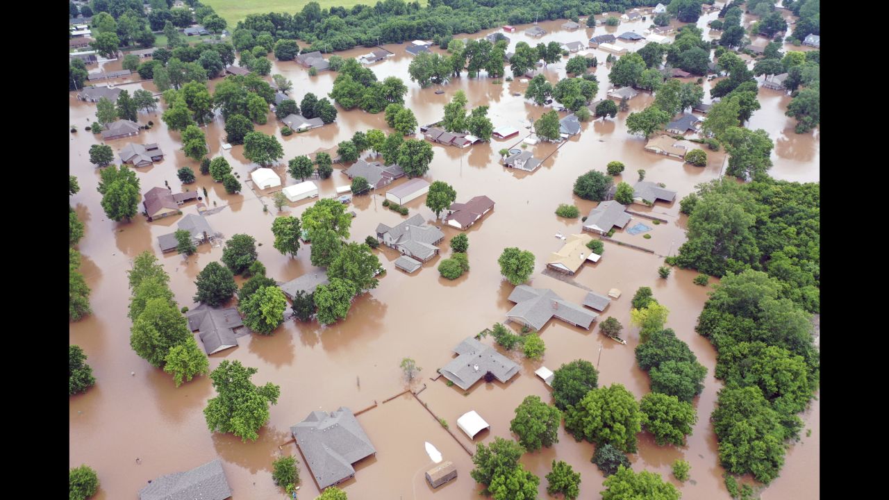 This aerial photo, taken on Tuesday, May 28, shows flooded homes along the Arkansas River in Sand Spring, Oklahoma. All 77 of Oklahoma's counties were under a state of emergency Tuesday because of <a href="https://www.cnn.com/2019/05/29/us/tulsa-floods-drones-helicopters-trnd/index.html" target="_blank">historic flooding. </a>