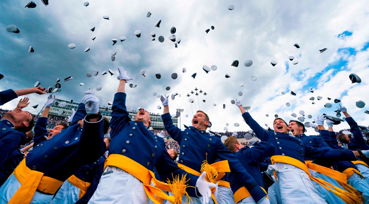 Cadets throw their caps in the air after graduating from the US Air Force Academy on Thursday, May 30.