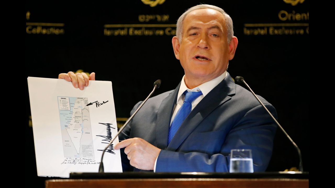 During a news conference on Thursday, May 30, Israeli Prime Minister Benjamin Netanyahu shows a map of Israel with the Golan Heights. It was signed by US President Donald Trump, he said. Trump also wrote an arrow with the word "Nice." Back in March, <a href="https://www.cnn.com/2019/03/25/politics/donald-trump-benjamin-netanyahu/index.html" target="_blank">Trump signed a proclamation</a> formally recognizing the contested Golan Heights as part of the state of Israel.