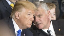 Franklin Graham, right, talks with President Donald Trump during a ceremony as the late evangelist Billy Graham lies in repose at the US Capitol, on February 28, 2018 in Washington, DC.