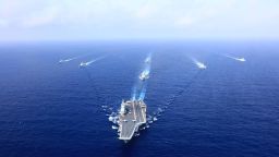 AT SEA - APRIL: A PLA Navy fleet including the aircraft carrier Liaoning, vessels and fighter jets take part in a drill in April 2018 in the South China Sea. (Photo by VCG)