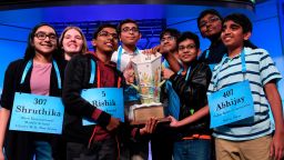 The eight co-champions of the 2019 Scripps National Spelling Bee, from left, Shruthika Padhy, 13, of Cherry Hill, N.J., Erin Howard, 14, of Huntsville, Ala., Rishik Gandhasri, 13, of San Jose, Calif., Christopher Serrao, 13, of Whitehouse Station, N.J., Saketh Sundar, 13, of Clarksville, Md., Sohum Sukhatankar, 13, of Dallas, Texas, Rohan Raja, 13, of Irving, Texas, and Abhijay Kodali, 12, of Flower Mound, Texas, hold the trophy at the end of the competition in Oxon Hill, Md., Friday, May 31, 2019. (AP Photo/Susan Walsh)