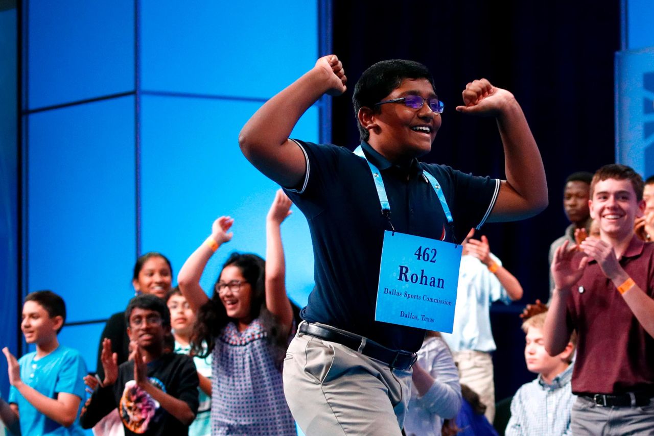 Rohan Raja, 13, of Irving, Texas, celebrates after becoming one of the champions.