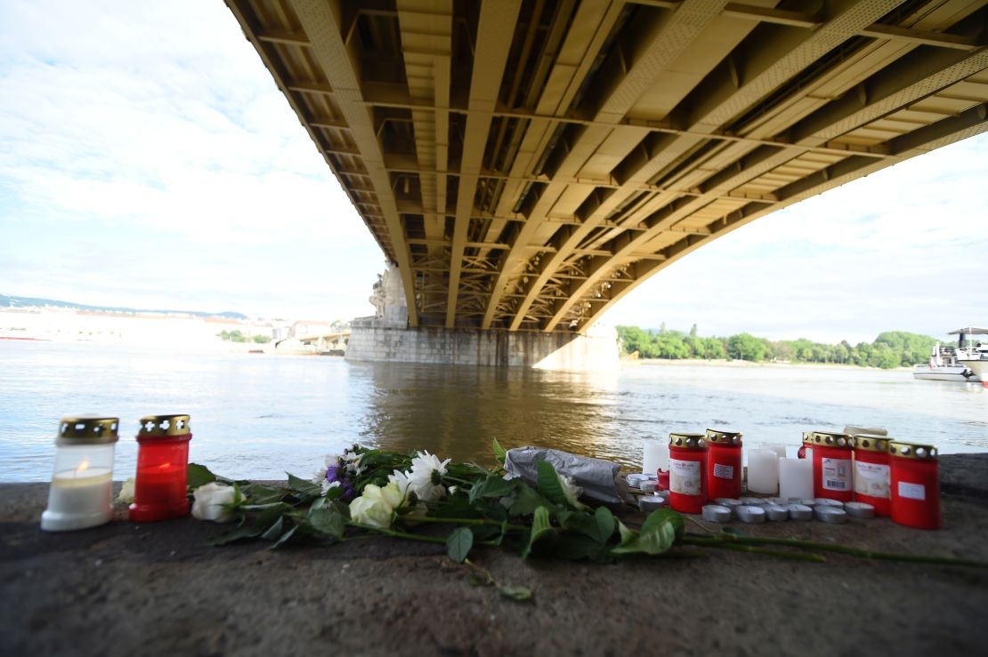 Flowers and candles have been placed on the banks of the Danube.