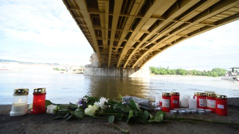 Flowers and candles have been placed on the banks of the Danube.