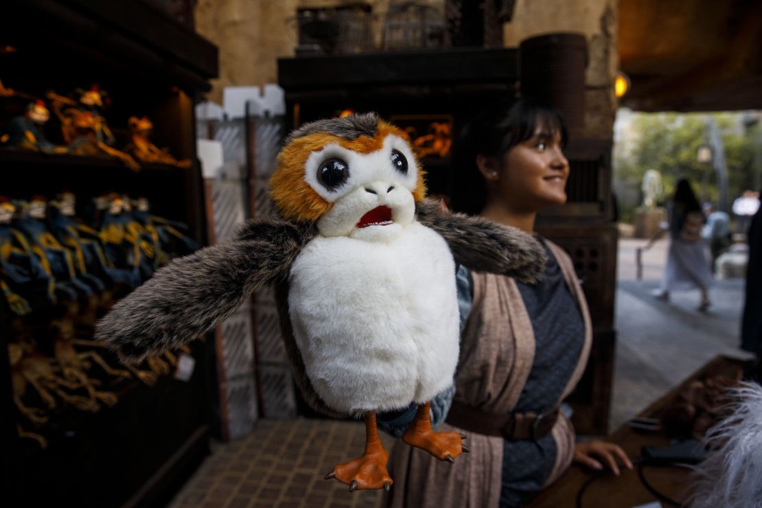 A Porg plush toy is displayed for sale in the Black Spire Outpost Marketplace.