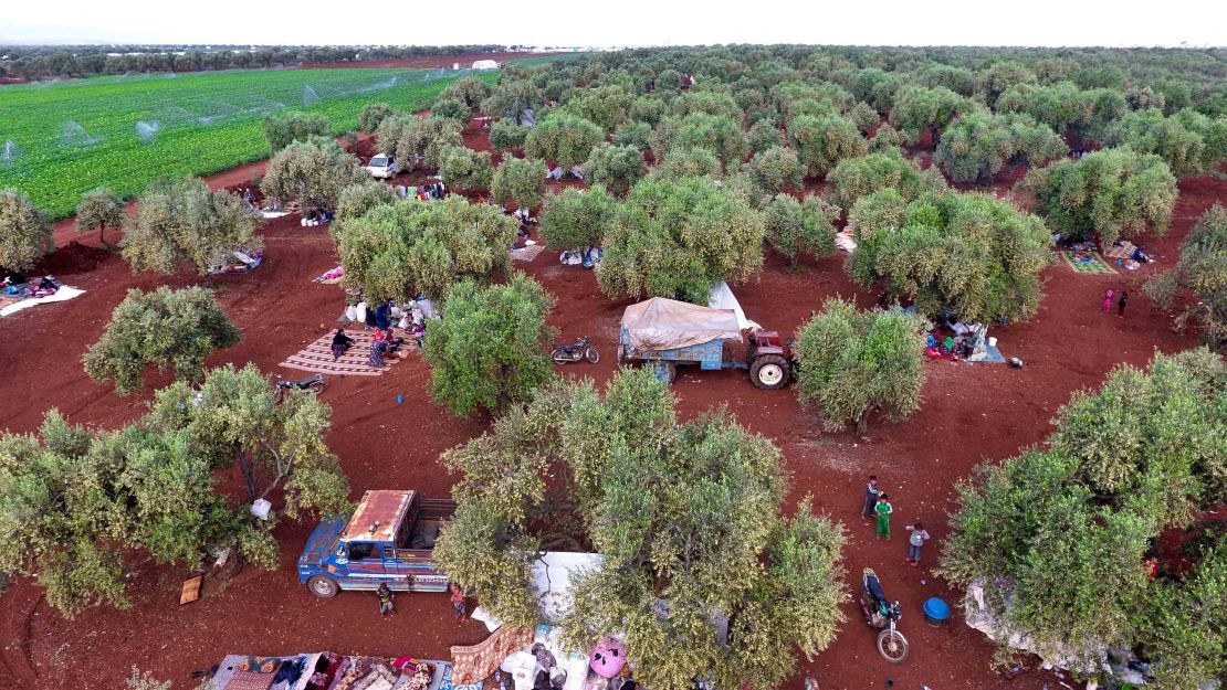 Syrians gathering in a field near a camp for displaced people in the village of Atme, Idlib earlier in May.