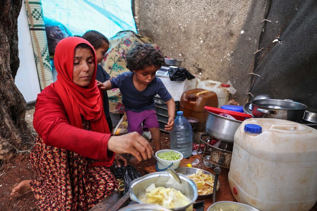 Displaced Syrian mother Mona Mutayr prepares an iftar meal in Atme during the Muslim holy fasting month of Ramadan.