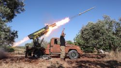 A Syrian fighter from the Turkish-backed National Liberation Front (NLF) fires a heavy artillery gun from the jihadist-held Idlib province against regime positions in the northern part of Hama province, on May 26, 2019. (Photo by OMAR HAJ KADOUR / AFP)        (Photo credit should read OMAR HAJ KADOUR/AFP/Getty Images)