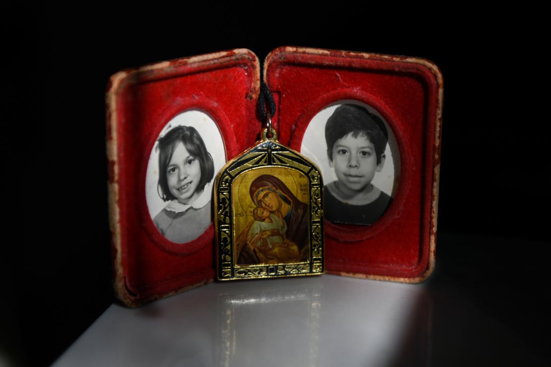 Childhood photographs of siblings Carla and Carlos Jr. Their mother carries these photographs and a necklace of the Virgin Mary everywhere she goes. 