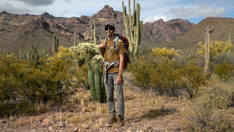 Scott Warren, a volunteer for the humanitarian aid organization No More Deaths, pauses while delivering food and water along remote desert trails used by undocumented immigrants on May 10 near Ajo, Arizona.