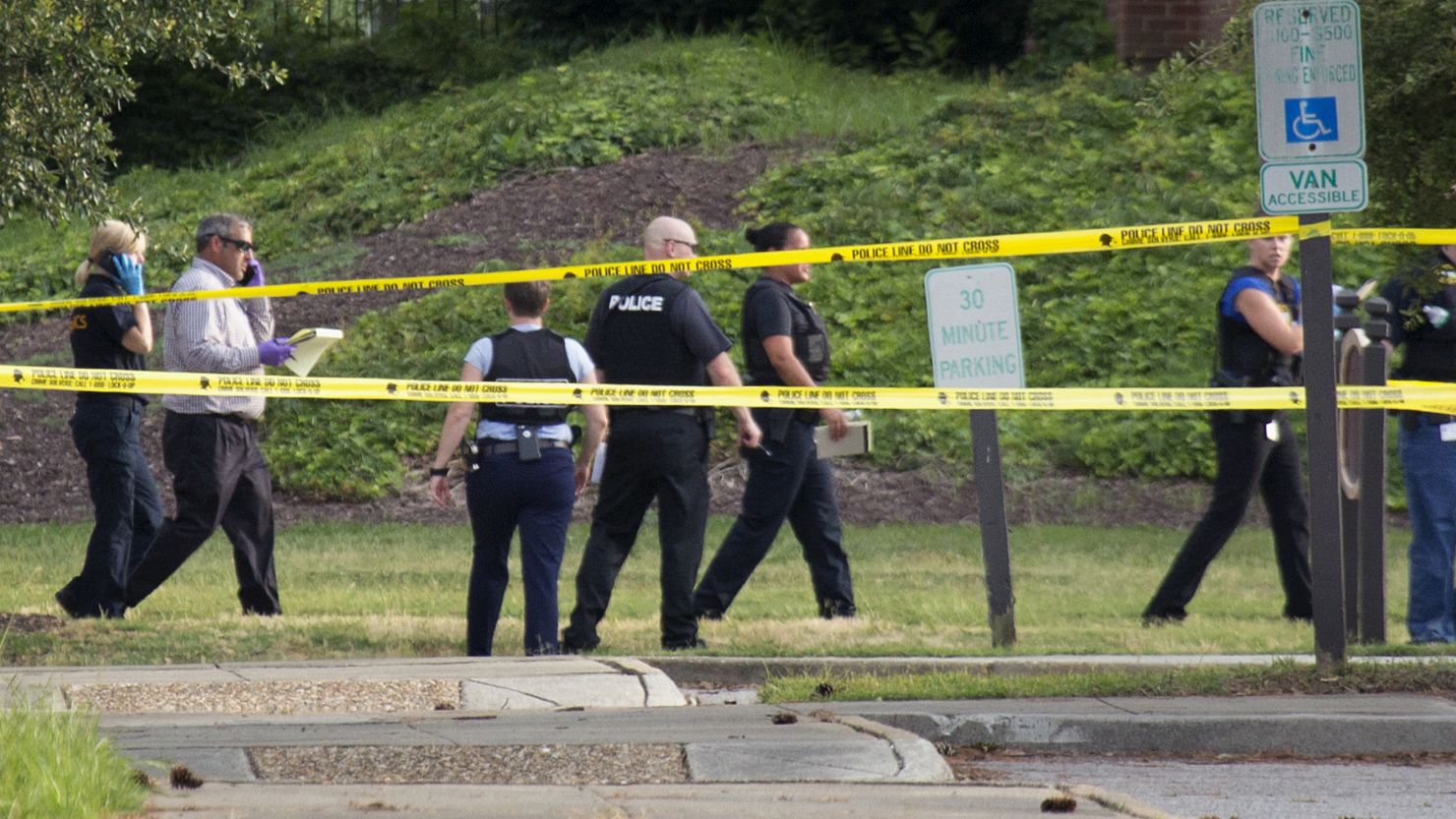 Police work the scene where 12 people were killed during a mass shooting at the Virginia Beach city public works building, on Friday, May 31.