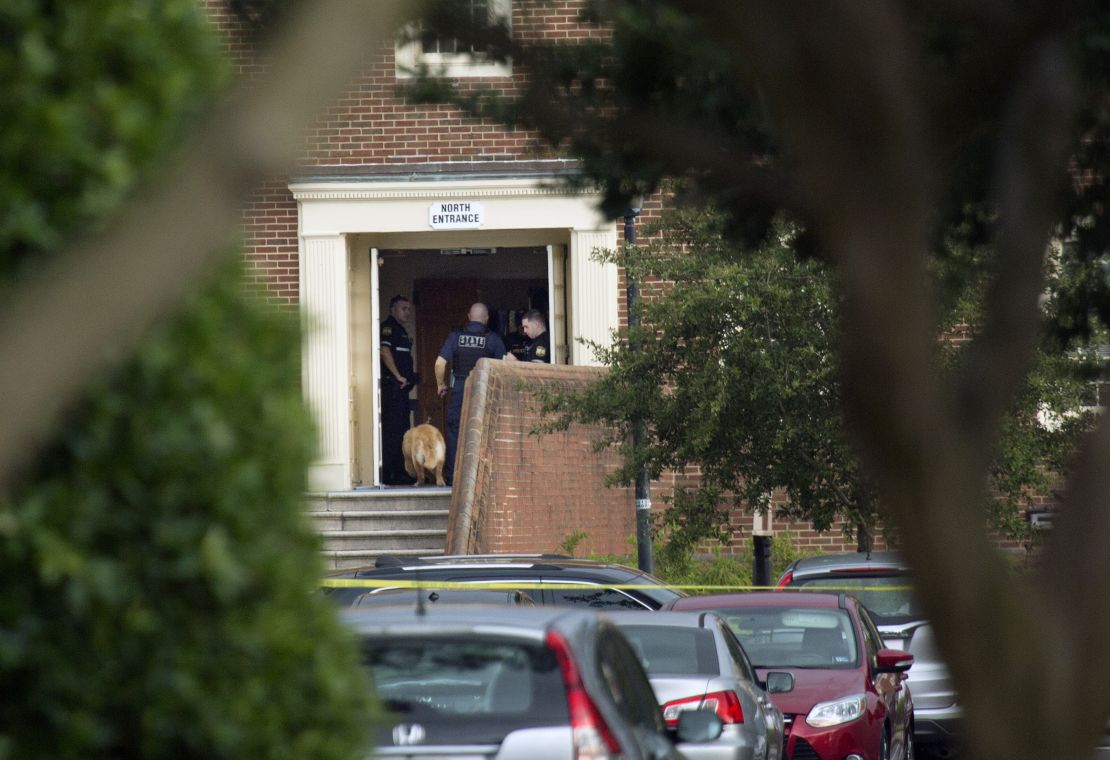 Police work the scene where 12 people were killed during a mass shooting at the Virginia Beach city public works building. 
