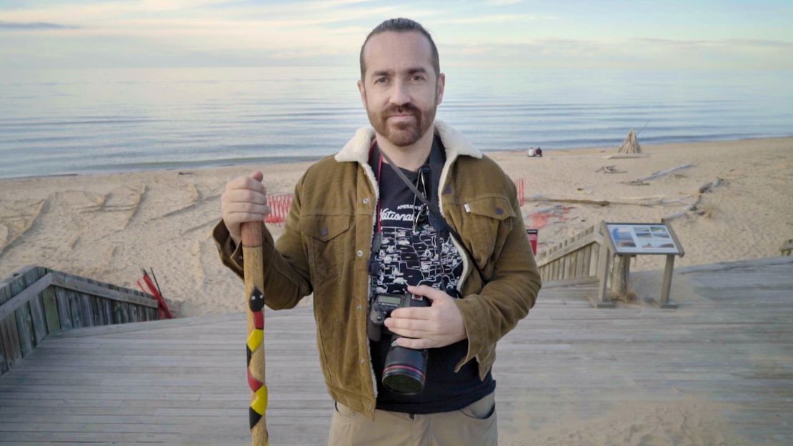 Andres Quintero, shown here at Indiana Dunes National Park, is on a quest to visit all 61 US national parks.