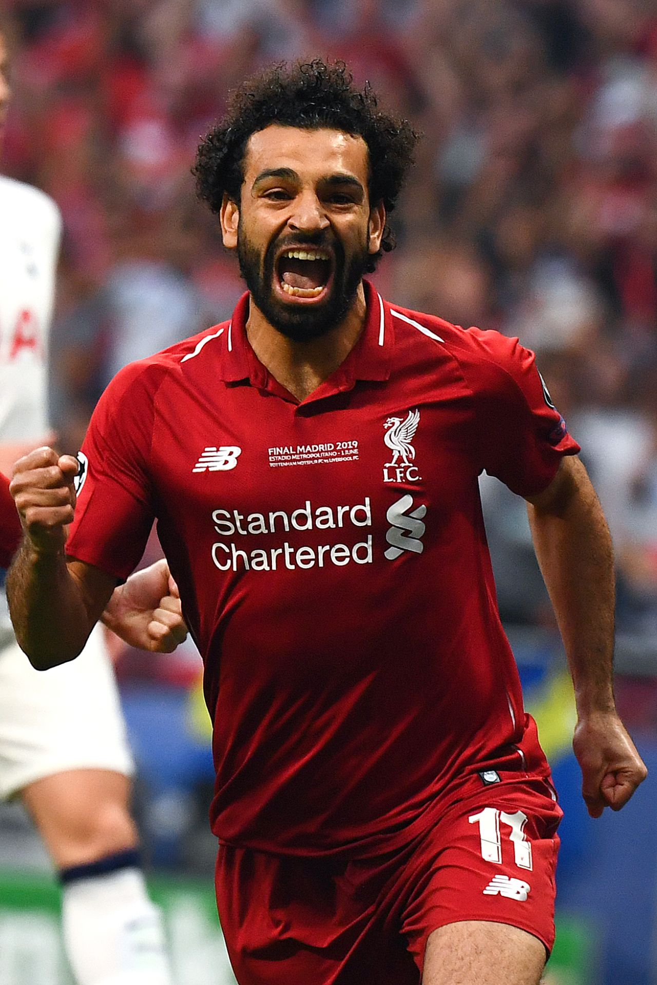 Liverpool's Egyptian forward Mohamed Salah celebrates after scoring the opening goal on a penalty in the second minute of the match. 