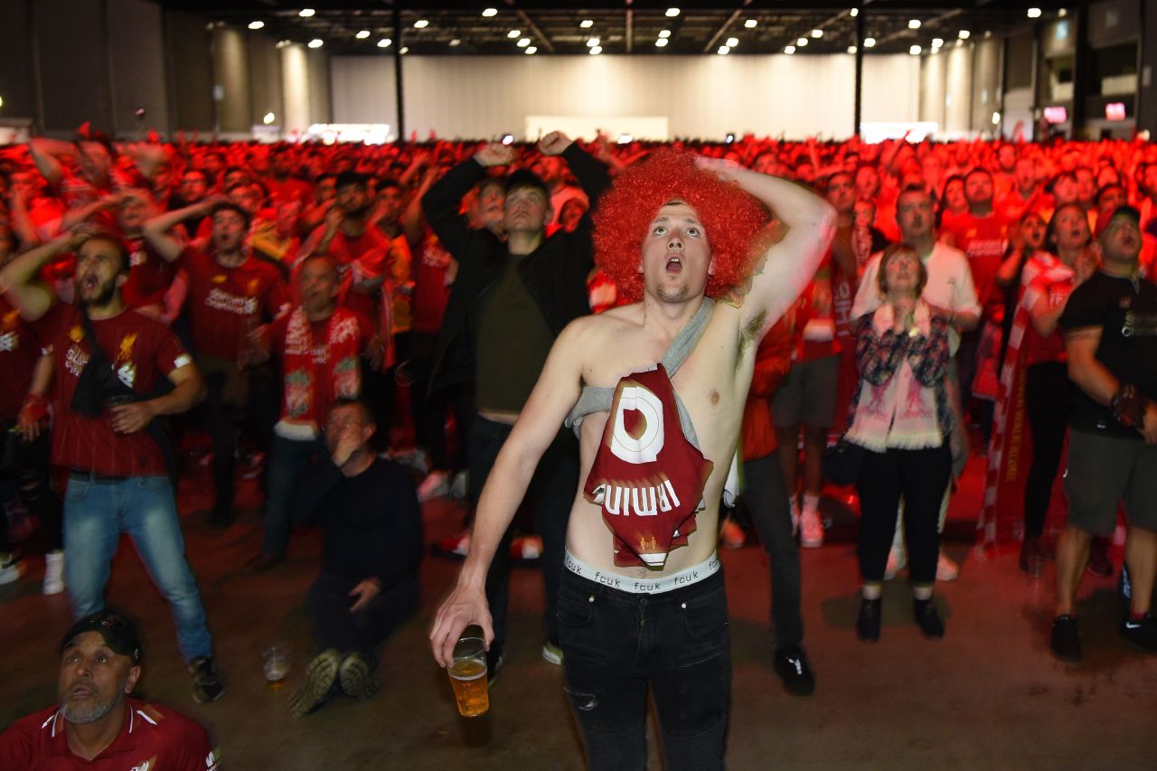 Liverpool supporters in the M&S Bank Arena in Liverpool react to Salah's goal. 
