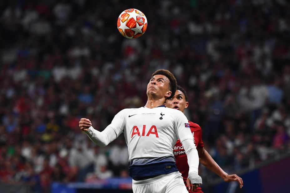 Tottenham Hotspur midfielder Dele Alli (L) vies with Liverpool defender Trent Alexander-Arnold.