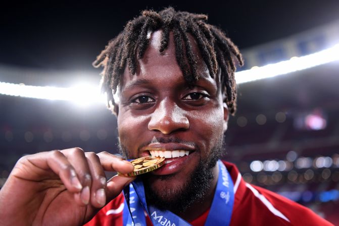 Divock Origi of Liverpool -- who came on to score the second goal -- celebrates with his medal after the match.