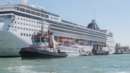 VENICE, ITALY - JUNE 02: A damaged tourist river boat can be seen docked next to a cruise liner after they collided on June 02, 2019 in Venice, Italy. At least four people were injured after the cruise liner MSC Opera lost control and smashed into a Venice dock earlier in the day. (Photo by Simone Padovani/Awakening/Getty Images)