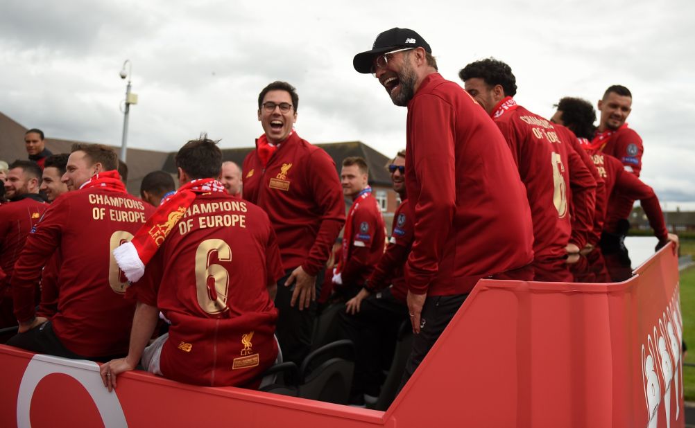 Liverpool's German manager Jurgen Klopp shares a laugh at the start of the parade. 