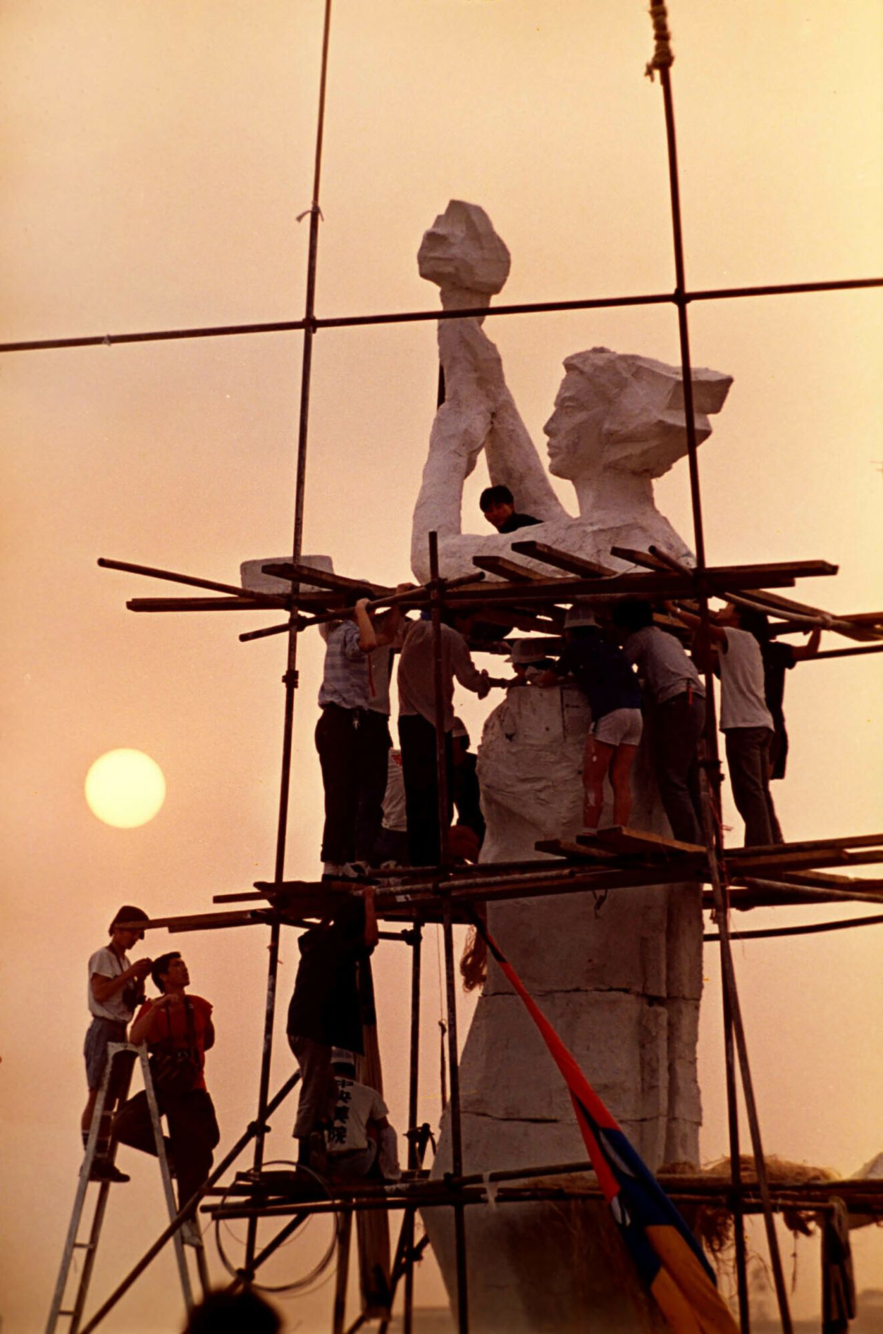 Students assemble the statue, which was made from Styrofoam and plaster, in Tiananmen Square.