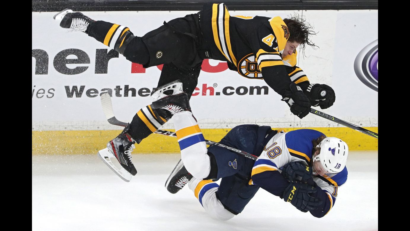 Torey Krug of the Boston Bruins checks Robert Thomas of the St. Louis Blues during the third period of Game 1 of the Stanley Cup Final at TD Garden on Monday, May 27.