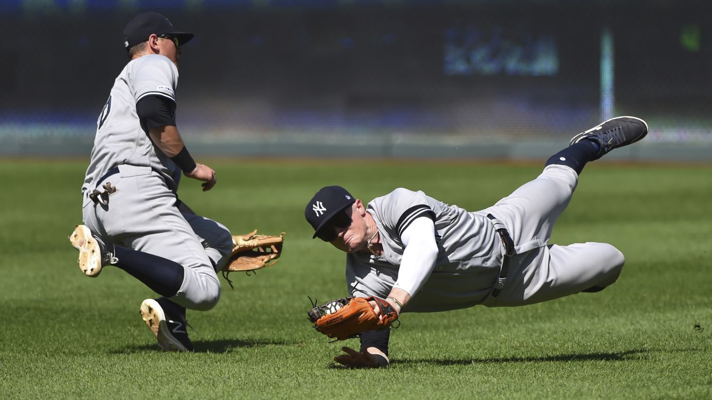 New York Yankees right fielder Clint Frazier, right, avoids a collision with second baseman DJ LeMahieu as he catches a ball during the ninth inning of a baseball game against the Kansas City Royals in Kansas City, Missouri, on May 26.
