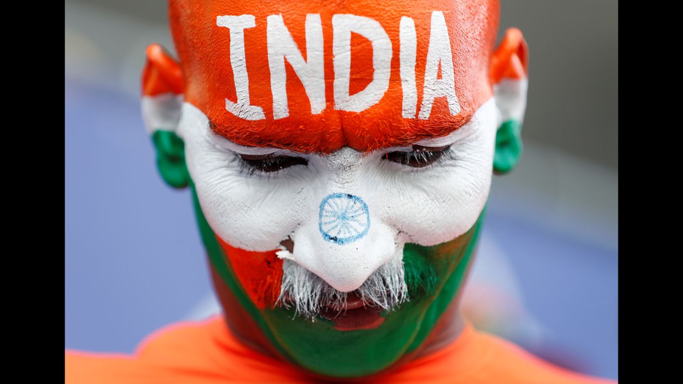 A fan, with his face painted like the Indian flag, looks on during a Cricket World Cup match between Bangladesh and India in Cardiff, England, on Tuesday, May 28.