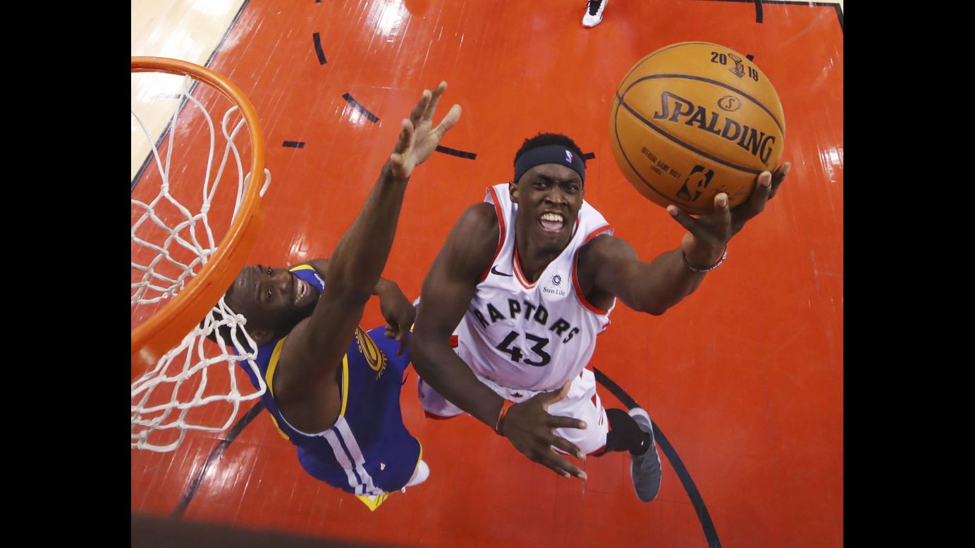 Pascal Siakam of the Toronto Raptors drives to the basket while being defended during Game 1 of the NBA Finals in Toronto on Thursday, May 30. Siakam shot 82.4% from the field and finished with a team-leading 32 points.