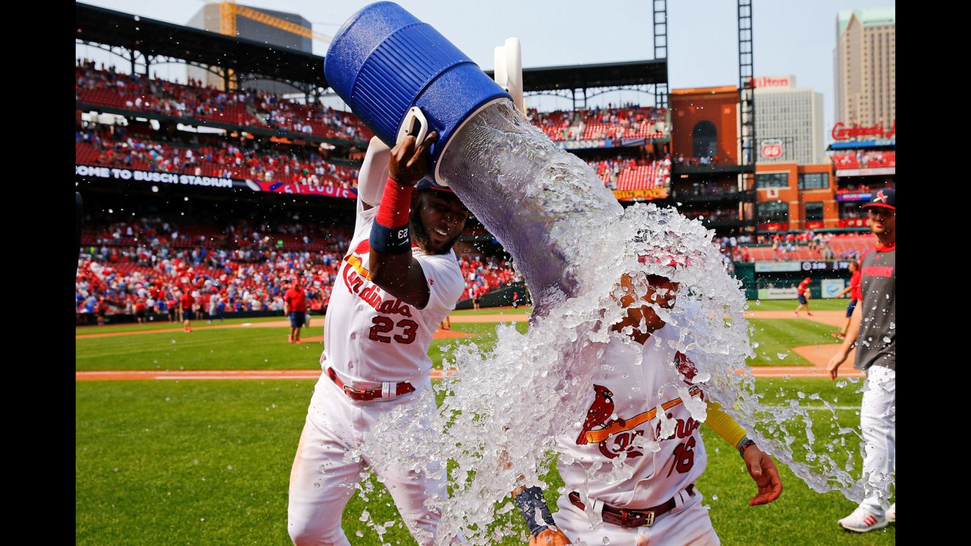 Marcell Ozuna of the St. Louis Cardinals douses teammate Kolten Wong after defeating the Chicago Cubs at Busch Stadium in St. Louis on Sunday, June 2.
