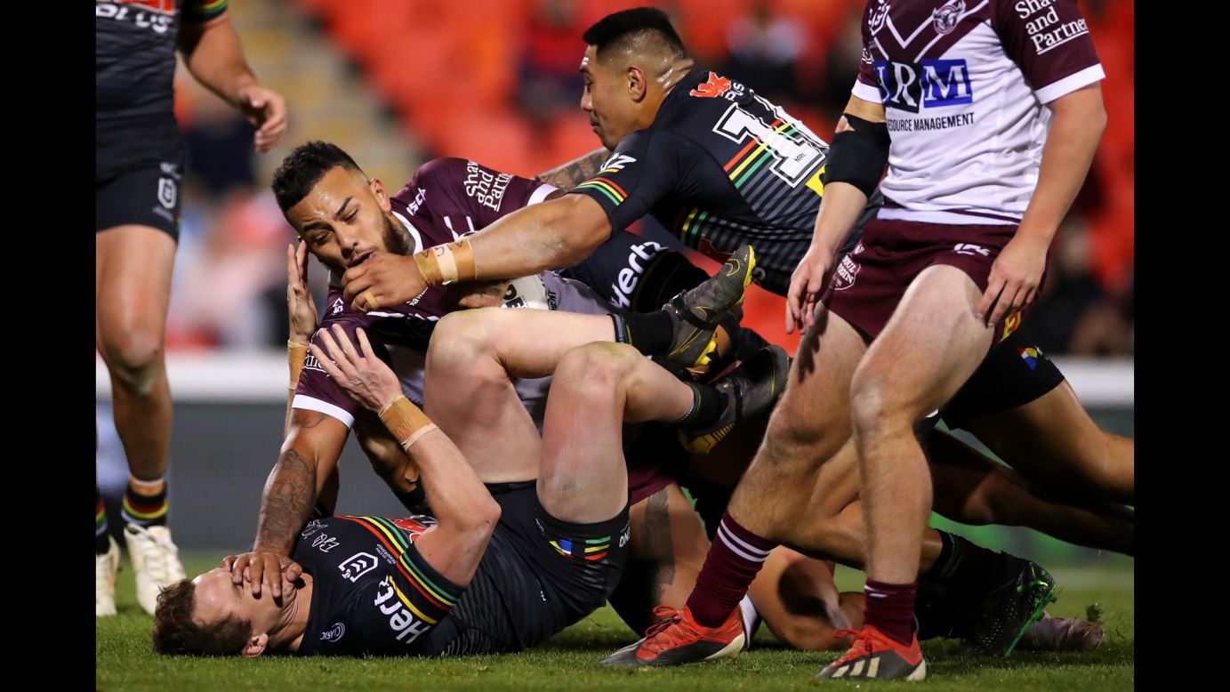 Addin Fonua-Blake of the Sea Eagles, center left, is tackled during the round 12 NRL match between the Penrith Panthers and the Manly Warringah Sea Eagles at Panthers Stadium in Sydney, Australia, on May 30.