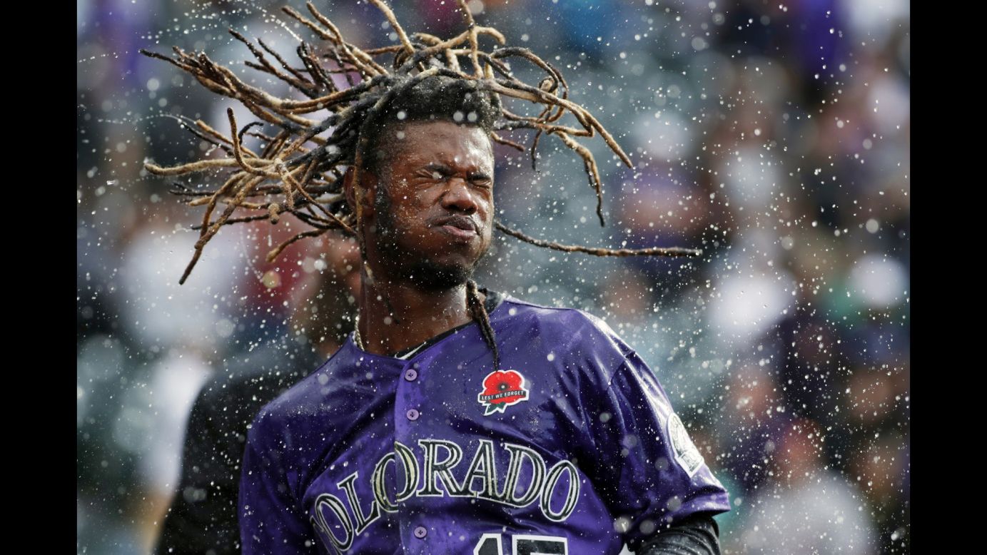 Colorado Rockies player Raimel Tapia shakes water from his head after being doused in celebration of his 11th inning walk-off single against the Arizona Diamondbacks in Denver, Colorado, on Monday, May 27. The Rockies won 4-3.