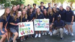 Wasswa Robbins and his classmates write signs for students in Uganda