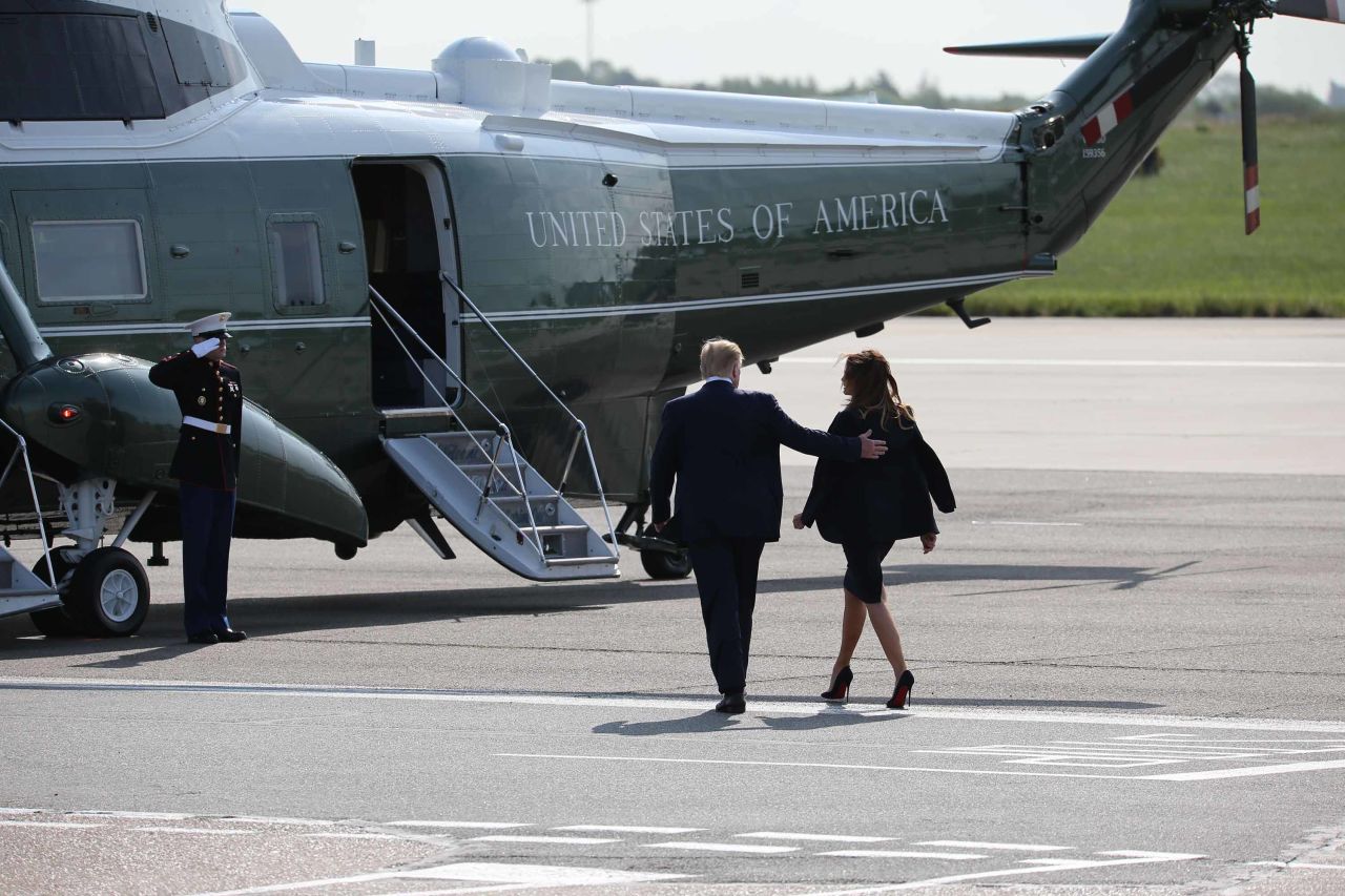 The Trumps walk toward Marine One after arriving at London's Stansted Airport on June 3.