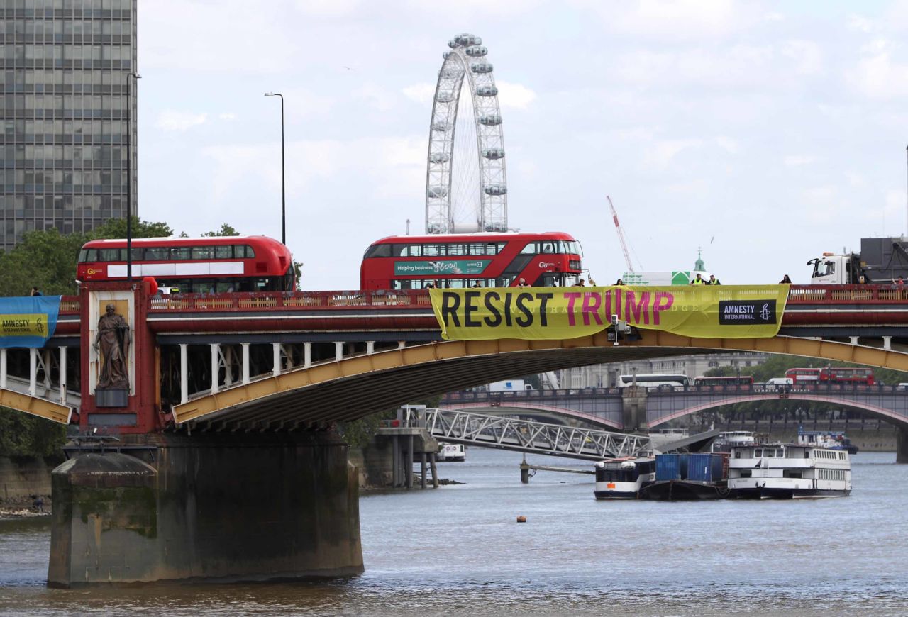 Amnesty International installs "Resist Trump" banners on Vauxhall Bridge in London.