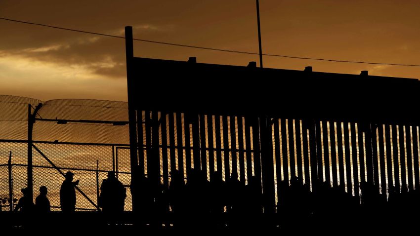 Migrants listen to U.S. Customs and Border Protection (CBP) officials after crossing illegally into the United States to request asylum in El Paso, Texas, U.S., in this picture taken from Ciudad Juarez, Mexico, April 5, 2019. REUTERS/Jose Luis Gonzalez