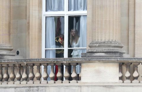 Trump's daughter Ivanka, who is also advisor to the President, looks out of a window at Buckingham Palace.