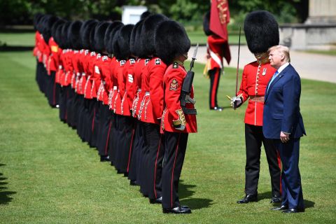 Trump inspects a guard of honor at Buckingham Palace.