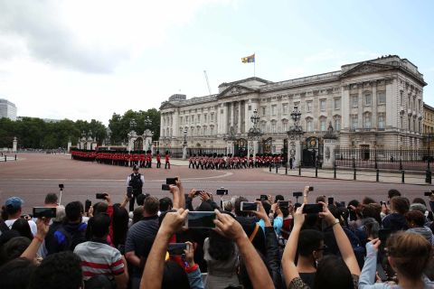 People outside Buckingham Palace photograph the Changing of the Guard ahead of Trump's arrival on June 3.