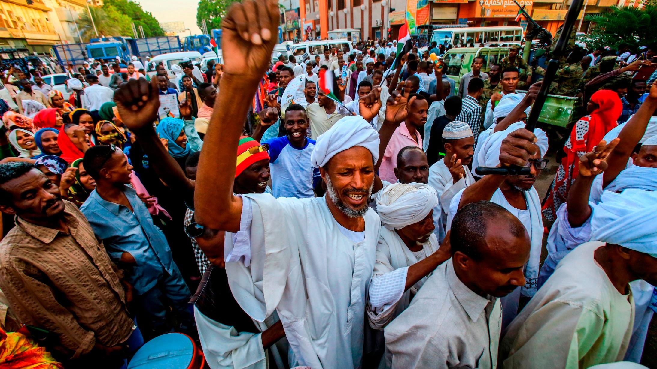 Sudanese supporters of the ruling Transitional Military Council chant slogans during a rally in the capital Khartoum on May 31.
