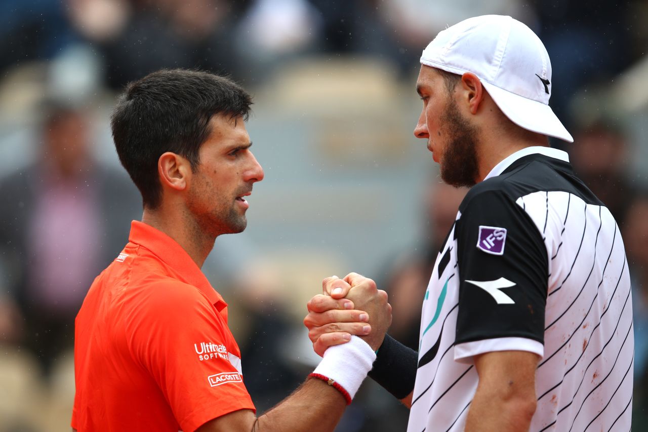 Novak Djokovic (left) swept past Jan-Lennard Struff to become the first man to make 10 straight French Open quarterfinals. 