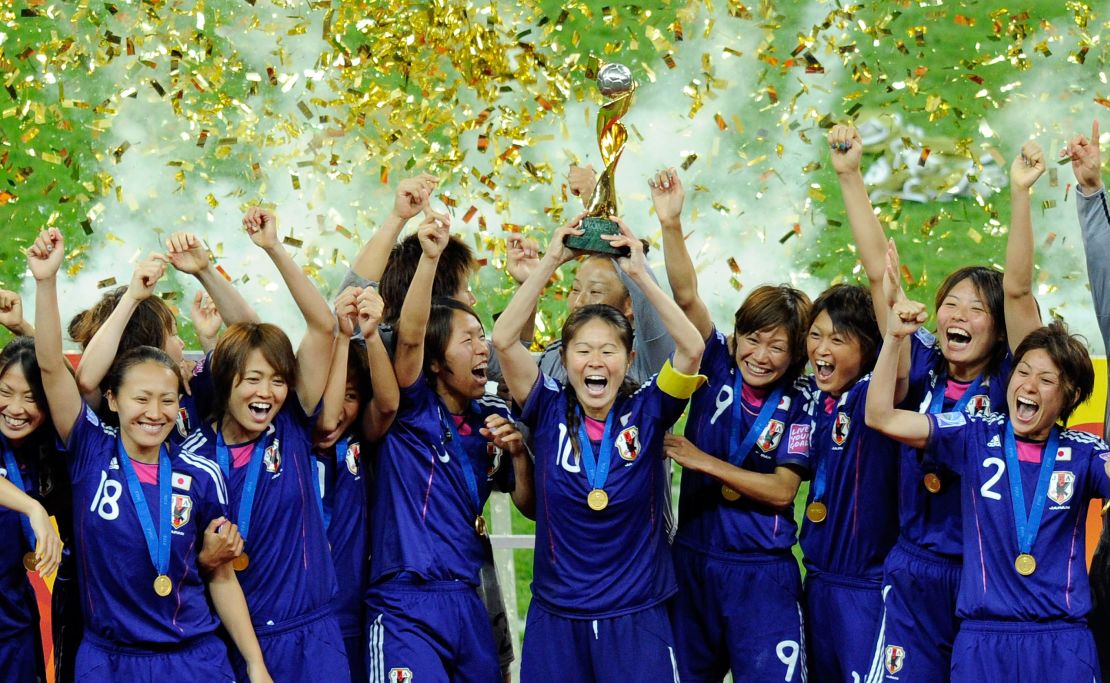 Japanese players lift the World Cup in 2011. 
