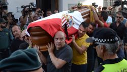 The coffin with the remains of Spanish football player Jose Antonio Reyes, covered with the flags of the village of Utrera and Sevilla FC football team, is carried on shoulders to the Santa Maria de Mesa church in Utrera, during the funeral for the footballer on June 3, 2019. - Former Arsenal, Real Madrid and Spain forward, Jose Antonio Reyes, 35, was killed in a car crash on June 1, 2019. Reyes shot to fame at Sevilla and secured a switch to Arsenal, where he was part of the unbeaten 'Invincibles' 2003-2004 Premier League winners, before spells at Real and Atletico Madrid. (Photo by CRISTINA QUICLER / AFP)        (Photo credit should read CRISTINA QUICLER/AFP/Getty Images)