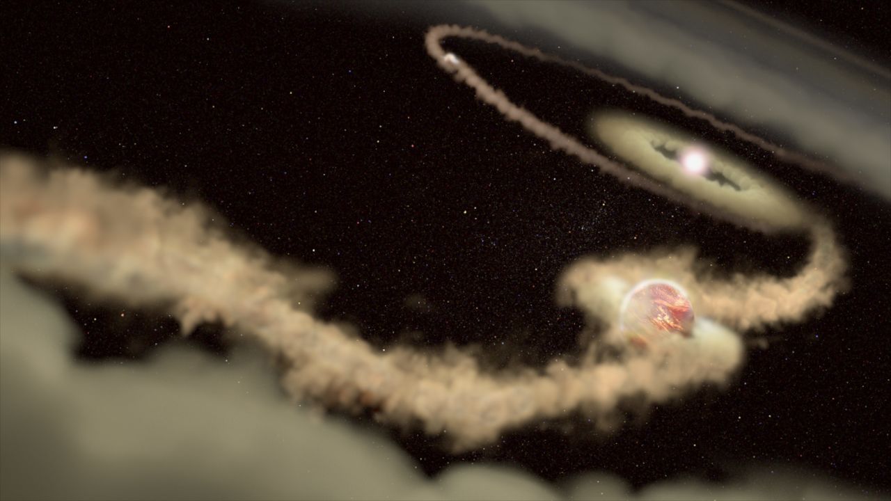 This artist's illustration shows two gas giant exoplanets orbiting the young star PDS 70. These planets are still growing by gathering material from a surrounding disk. In the process, they have gravitationally carved out a large gap in the disk.