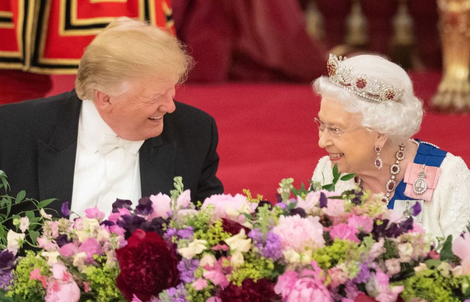 Trump and the Queen laugh during the state banquet.