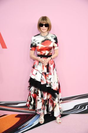 Anna Wintour paired a printed Alexander McQueen dress with a pair of her trademark sunglasses. 