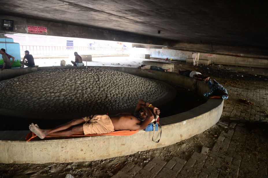 An Indian man rests under a bridge during a hot summer afternoon in Allahabad on Sunday, June 2.