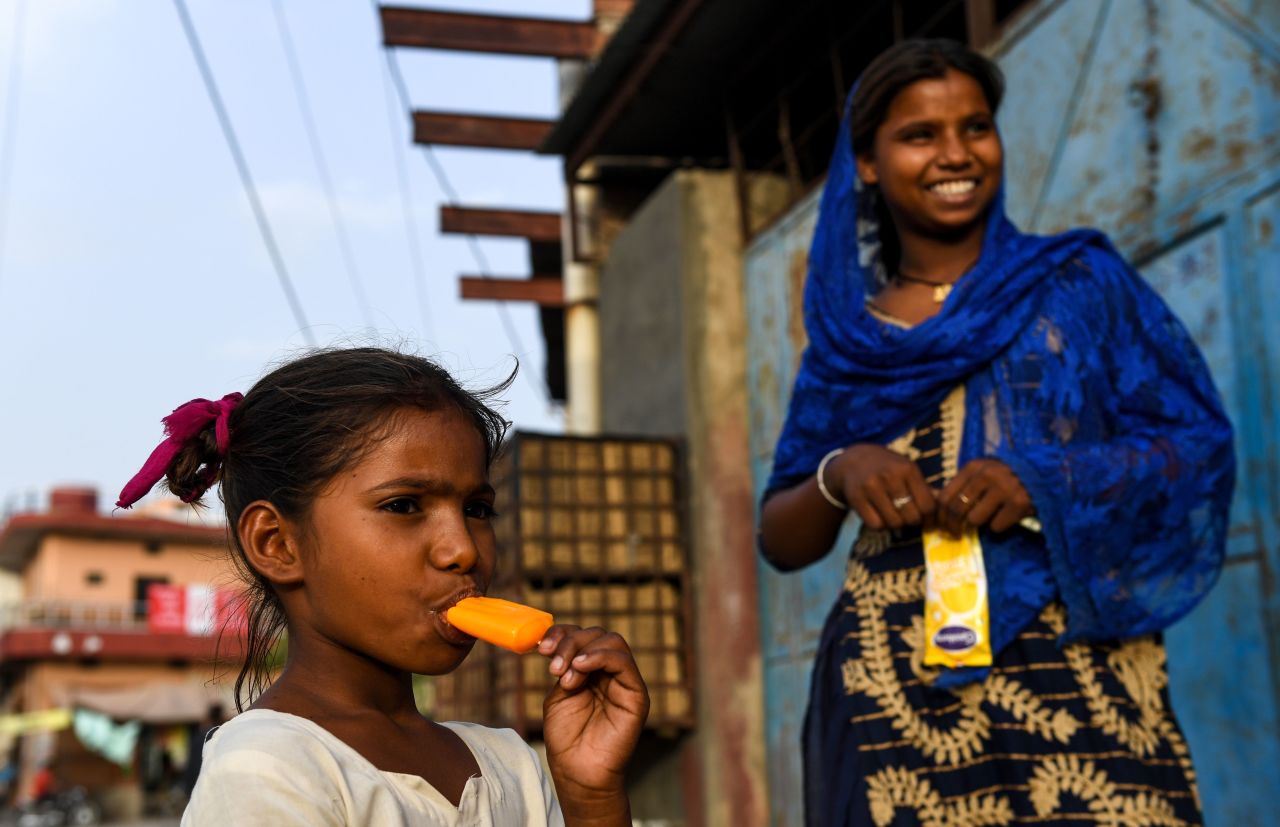 An Indian girl eats an ice lolly during a hot day in Churu in Rajastahn on Monday, June 3.