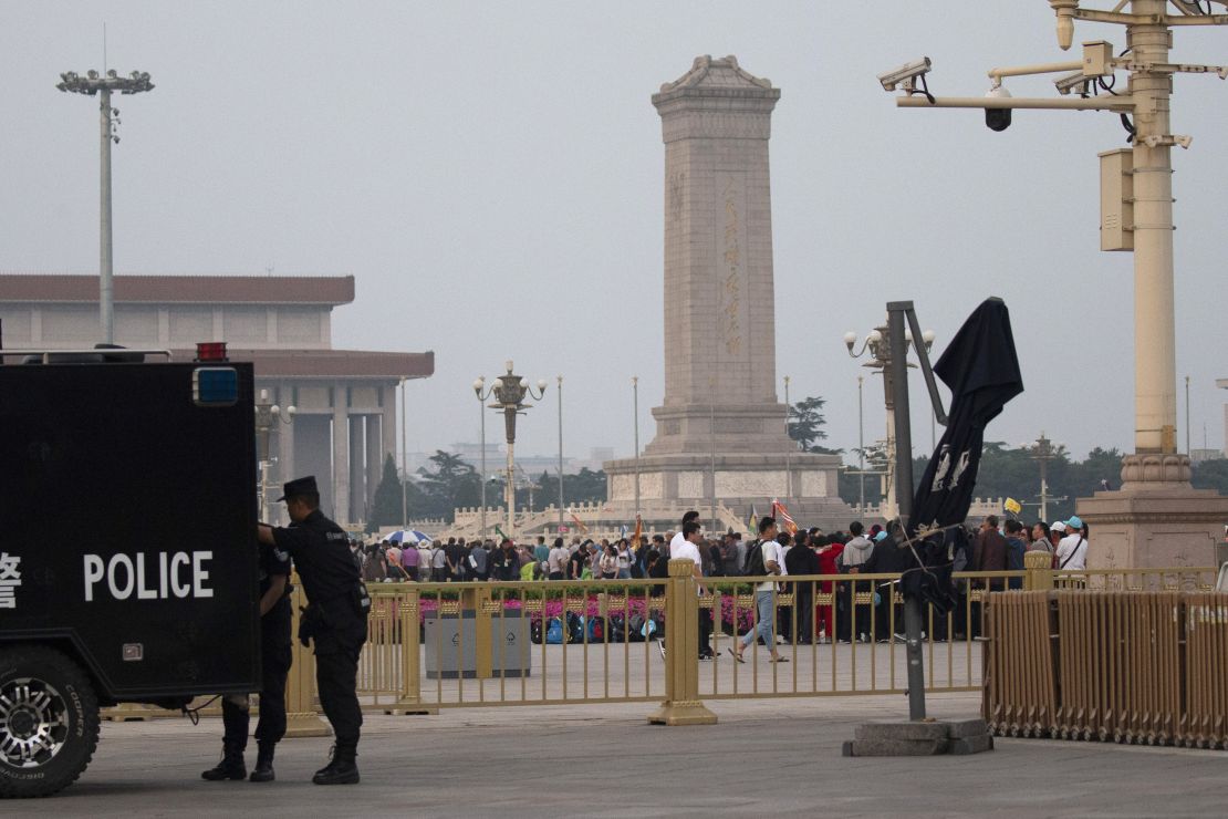 Visitors gather around the Monument to the People's Heroes on Tiananmen Square during the 30th anniversary of a bloody crackdown of pro-democracy protesters in Beijing on Tuesday, June 4, 2019.