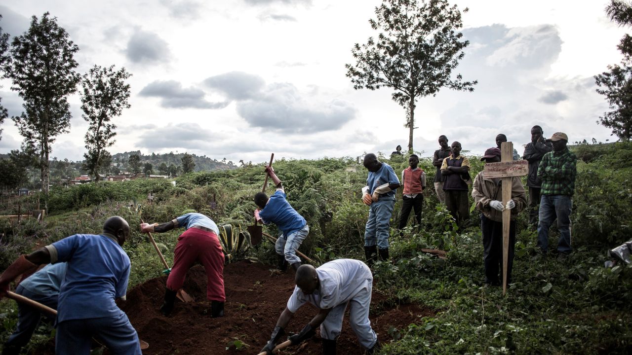 Family members  watch the deceased victim of the Ebola virus being buried on May 16, 2019 in Butembo. The city of Butembo is at the epicentre of the Ebola crisis in the DR Congo. 